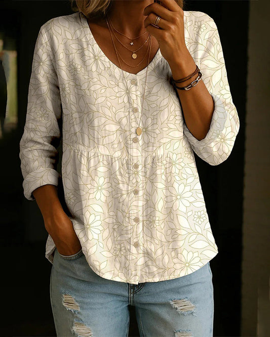 BLUSA ESTAMPADA CON CUELLO DE V CON BOTONES SOBRE EL DELANTERO
