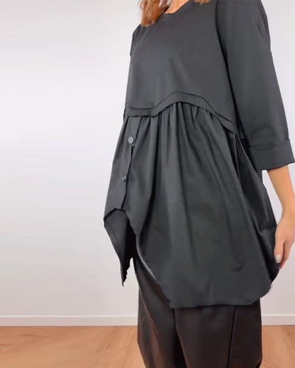 BLUSA LÍNEA A ASIMÉTRICA PLISADO