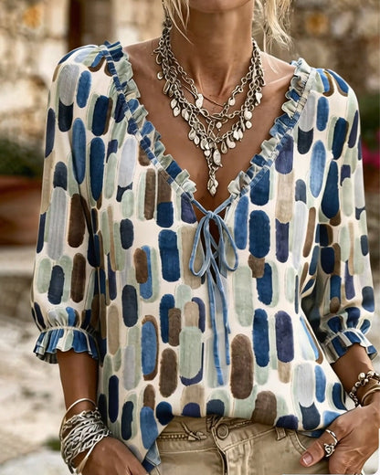 BLUSA BLOQUES DE COLOR VOLANTE ATADO CUELLO DE V