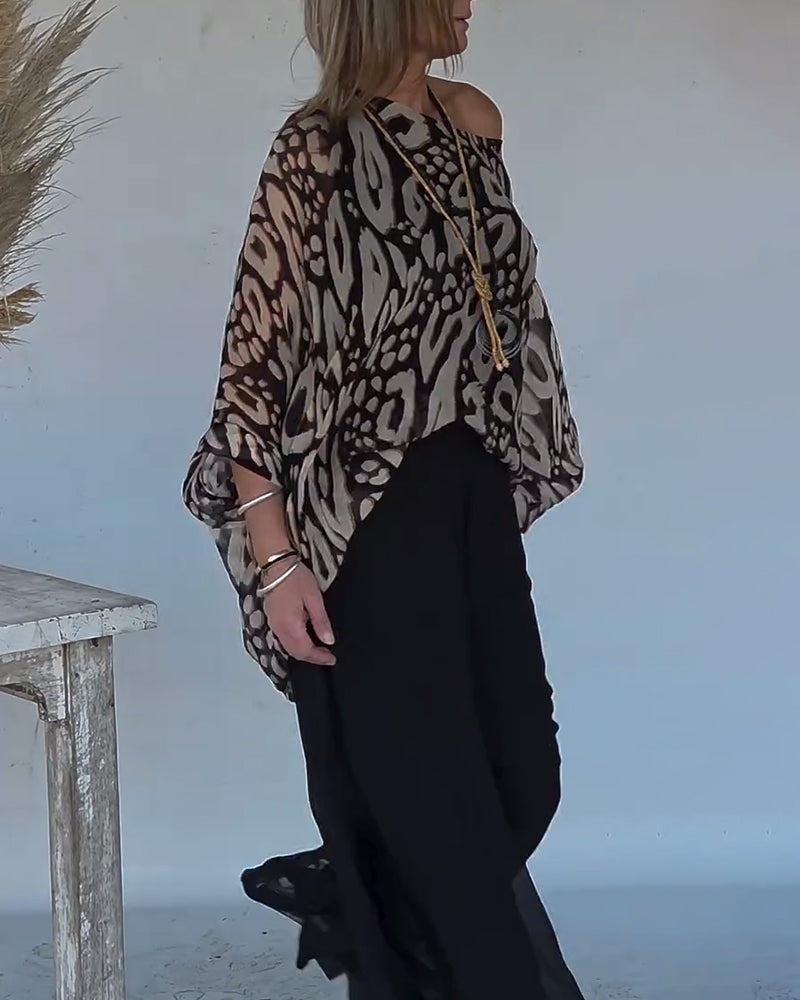 BLUSA CON MANGA LARGA CON ESTAMPADO MURCIÉLAGO ASIMÉTRICO