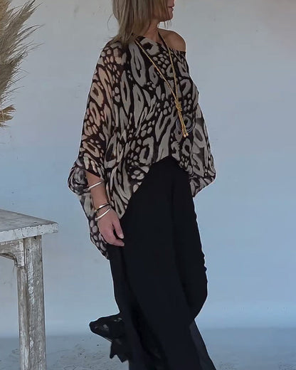 BLUSA CON MANGA LARGA CON ESTAMPADO MURCIÉLAGO ASIMÉTRICO