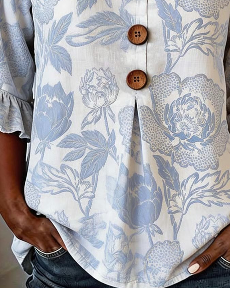 BLUSA ESTAMPADA PUÑO CON VOLANTES