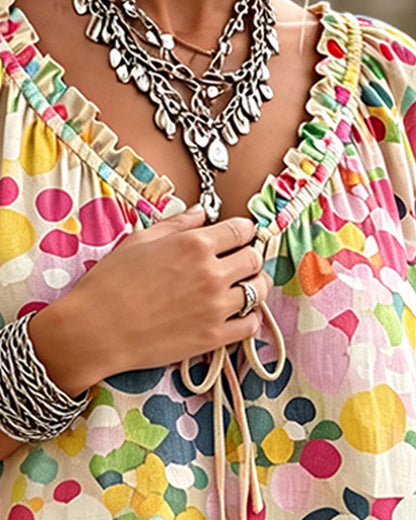 BLUSA CUELLO DE V DE LUNARES CON CORDONES