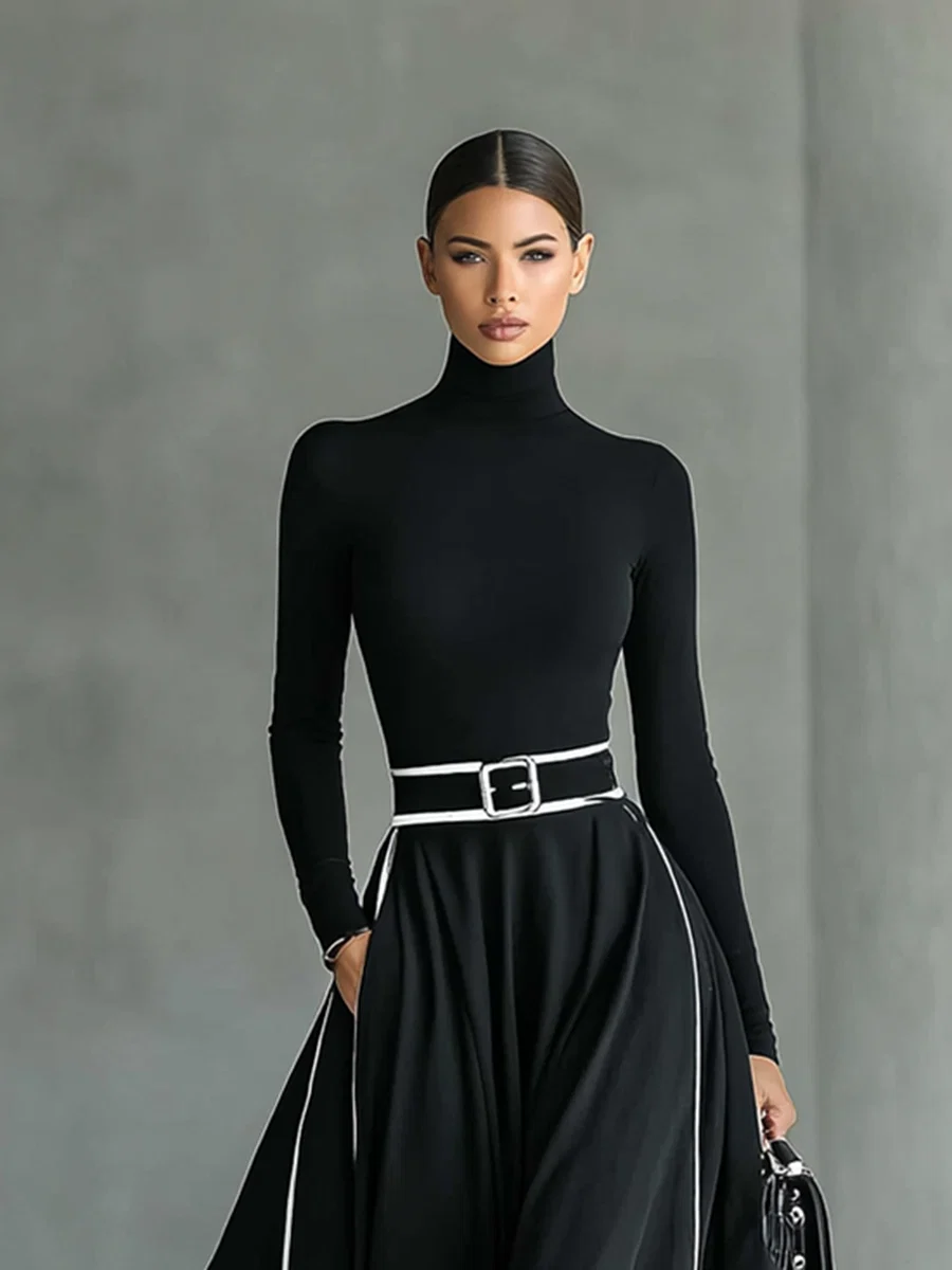 VESTIDO LARGO NEGRO CON COSTURAS BLANCAS, CUELLO ALTO Y MANGA LARGA