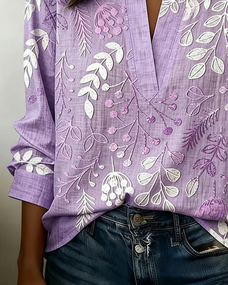 BLUSA CON ESTAMPADO FLORAL Y CUELLO ALTO