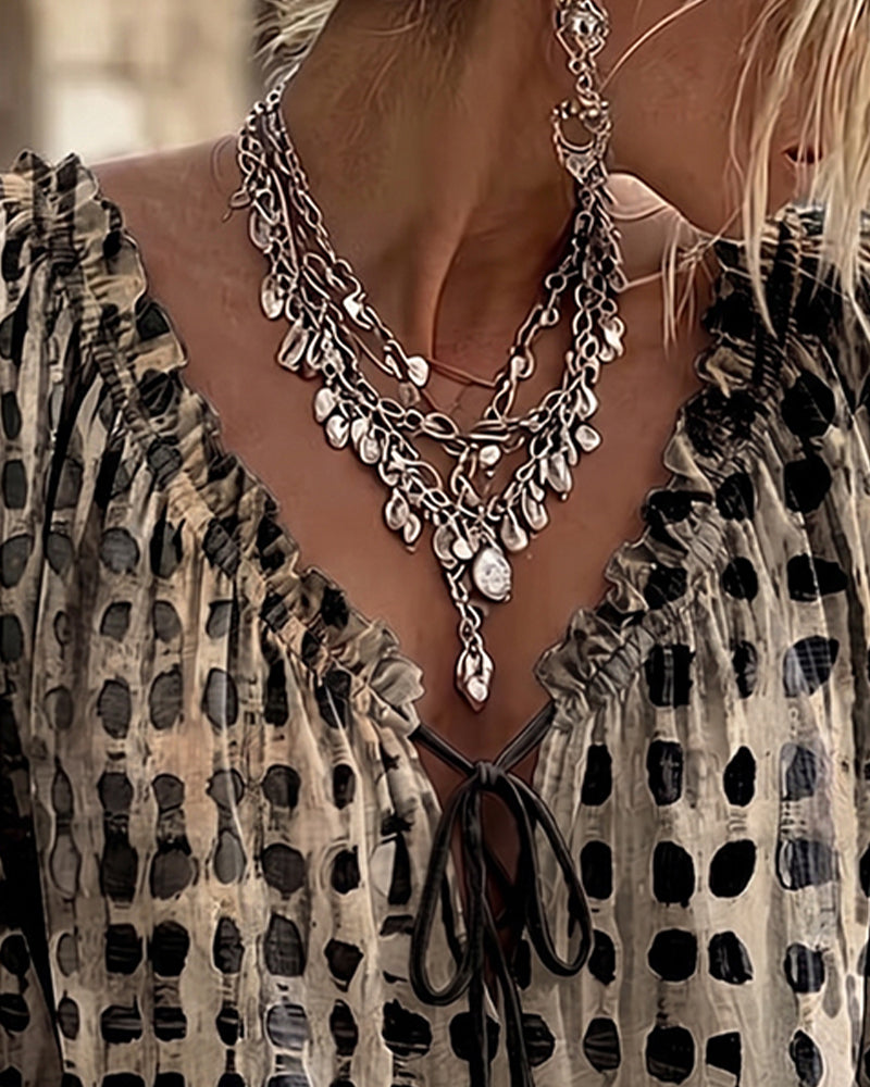 BLUSA DE LUNARES CON CORDONES