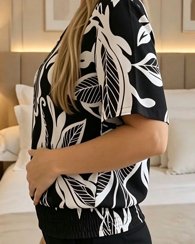 BLUSA ESTAMPADO FLORAL BAJO ELÁSTICO MANGA CORTA