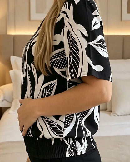 BLUSA ESTAMPADO FLORAL BAJO ELÁSTICO MANGA CORTA
