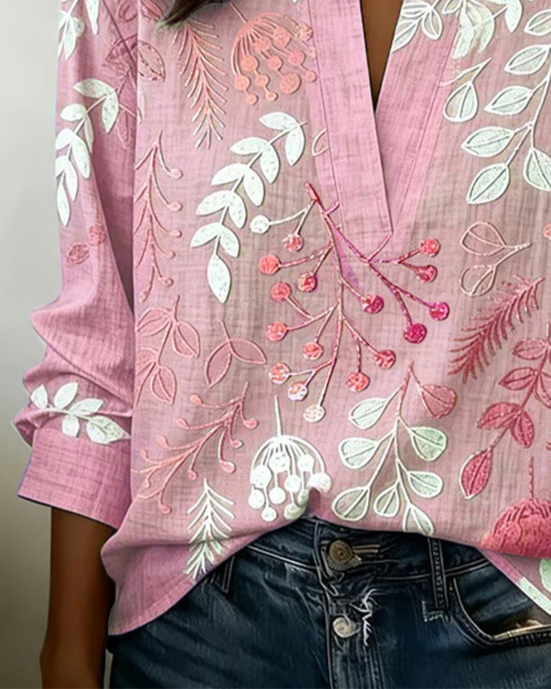 BLUSA CON ESTAMPADO FLORAL Y CUELLO ALTO