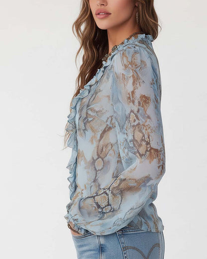 BLUSA ESTAMPADA CON MANGA LARGA CON CIERRE CON CREMALLERA Y VOLANTES
