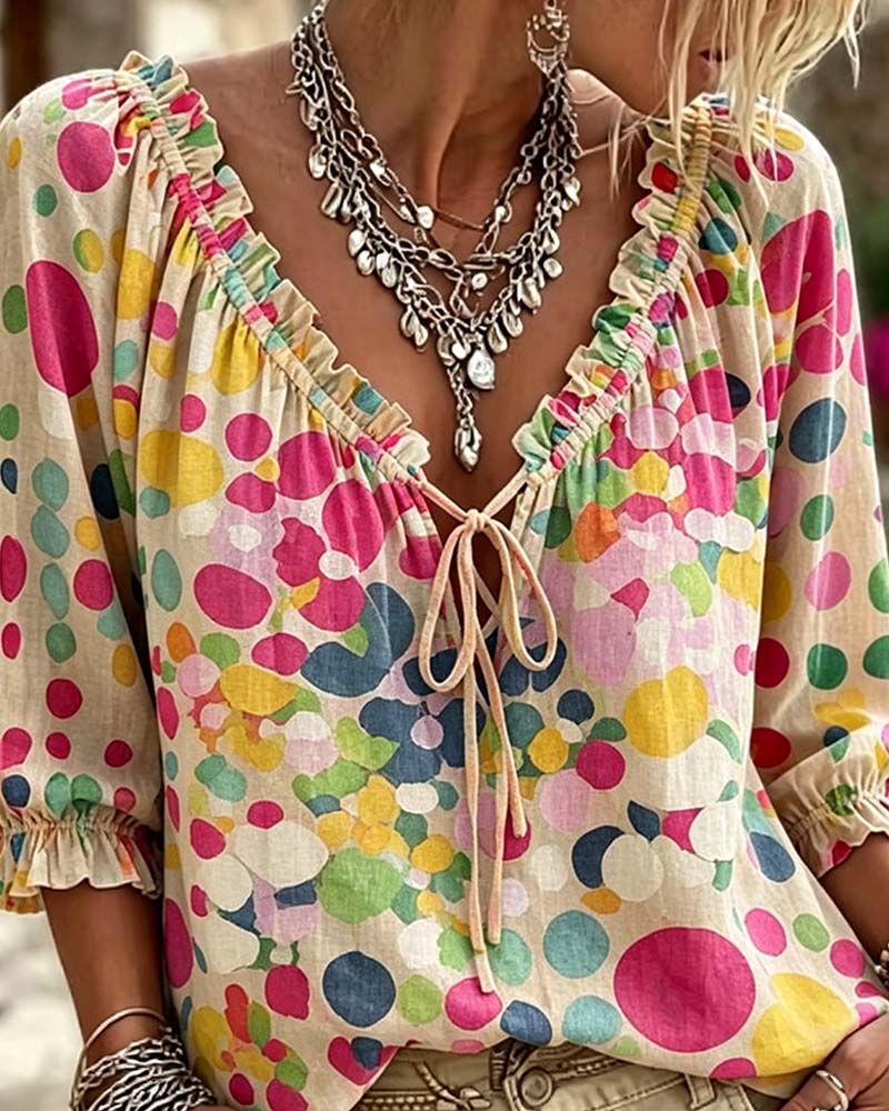 BLUSA CUELLO DE V DE LUNARES CON CORDONES