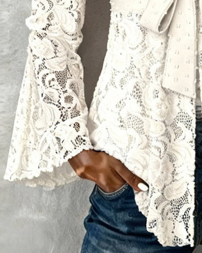 BLUSA LISA CON MANGAS GLOBO Y CUELLO DE V