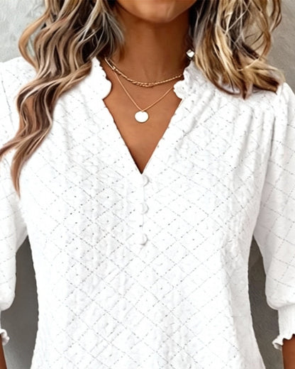 TOP CUELLO DE V ROMBOS MANGA CORTA