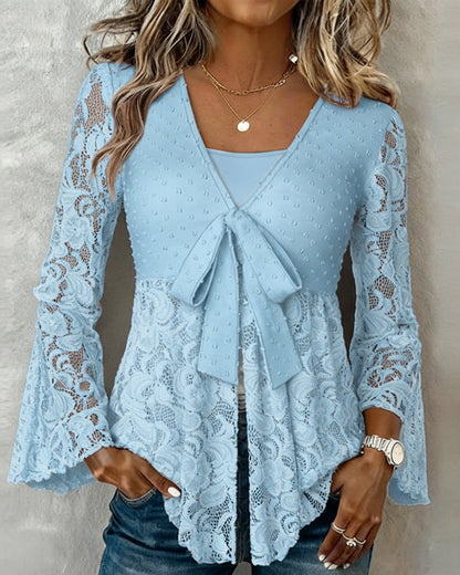 BLUSA LISA CON MANGAS GLOBO Y CUELLO DE V