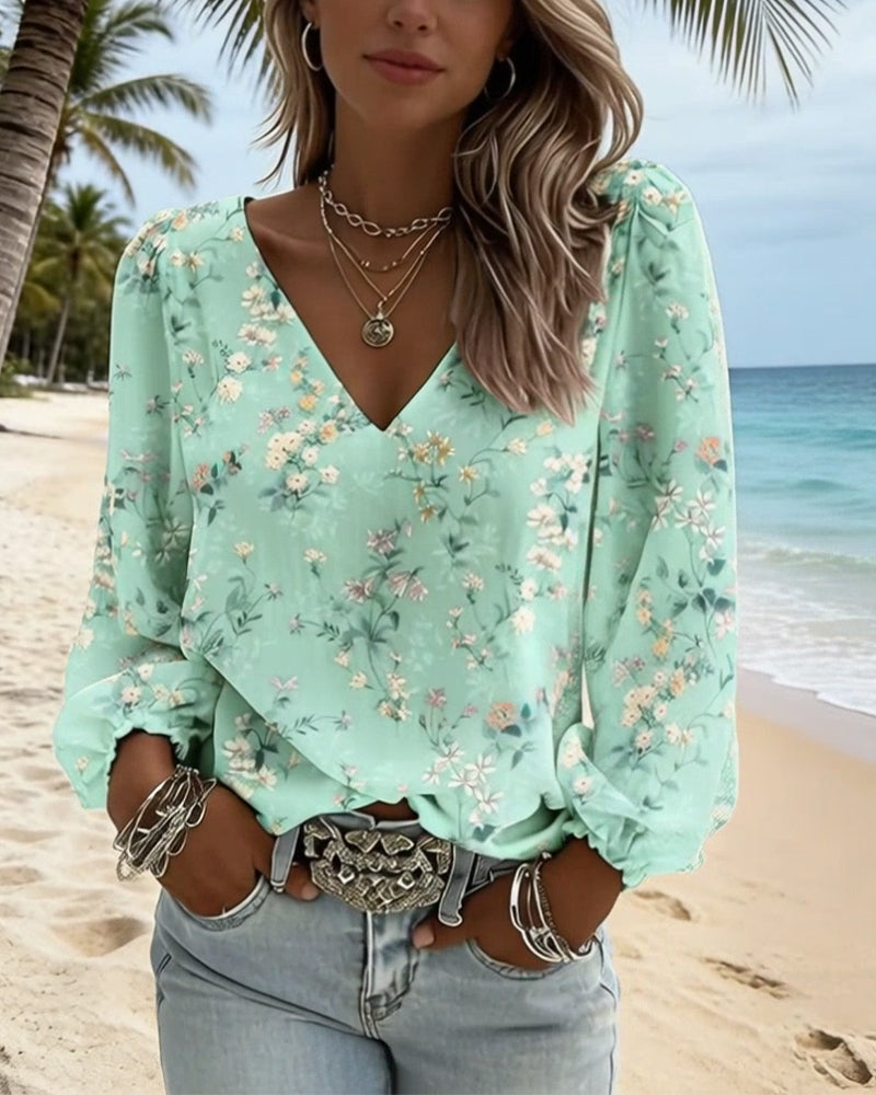 BLUSA FLORAL CUELLO DE V MANGAS ABULLONADAS