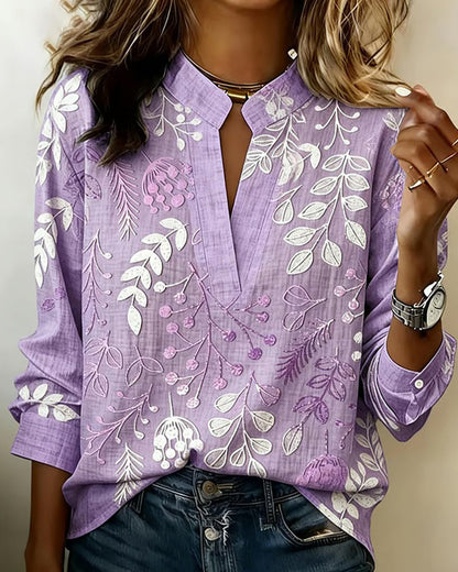 BLUSA CON ESTAMPADO FLORAL Y CUELLO ALTO