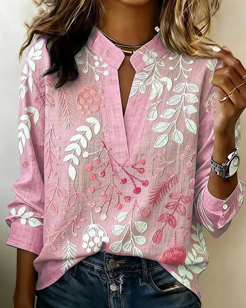 BLUSA CON ESTAMPADO FLORAL Y CUELLO ALTO