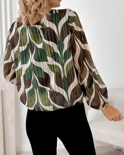 BLUSA CON MANGAS GLOBO Y CUELLO REDONDO