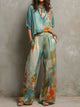 CLARA | CONJUNTO ELEGANTE CON ESTAMPADO FLORAL Y PANTALÓN ANCHO